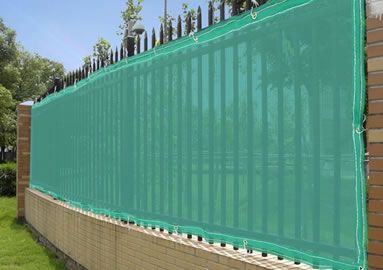 High-tensile screen fabric installed as a privacy fence