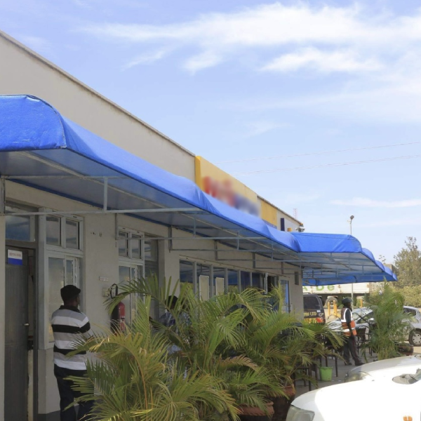 Permanent canopy covering an outdoor seating space